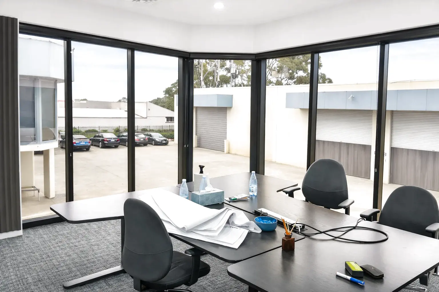 Glass office building façade with reflective solar tinted windows